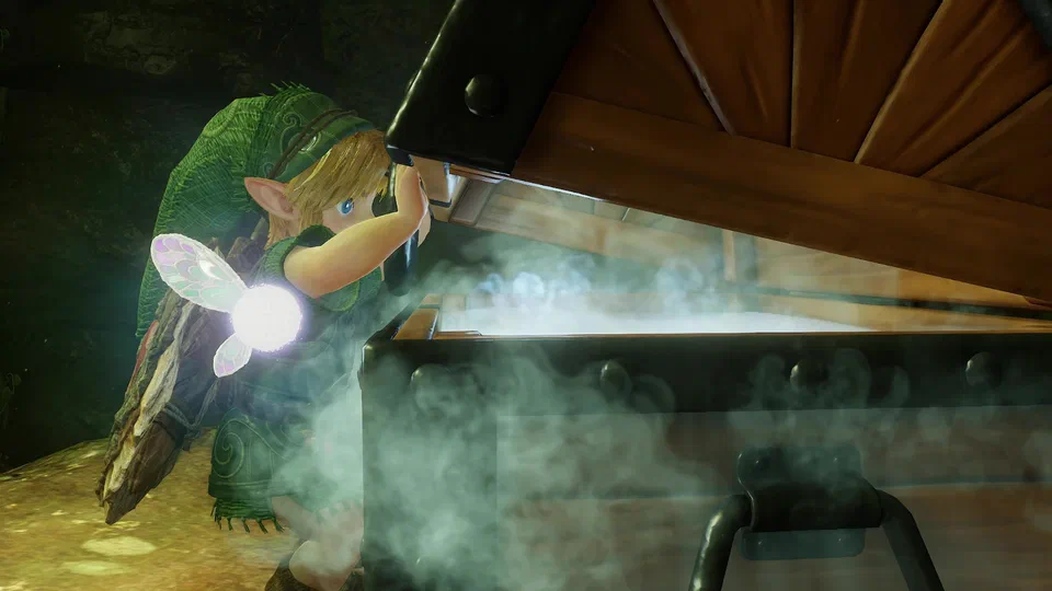 Close-up of Link lifting the heavy lid of a large iron-banded wooden treasure chest inside the Deku Tree, mist pouring out, Navi hovering at his shoulder