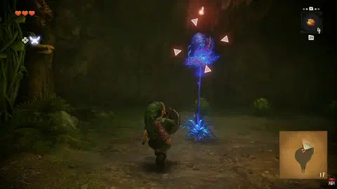 The Deku Baba frozen upright and glowing electric blue after being hit by a Deku Nut, still framed by the lock-on reticle