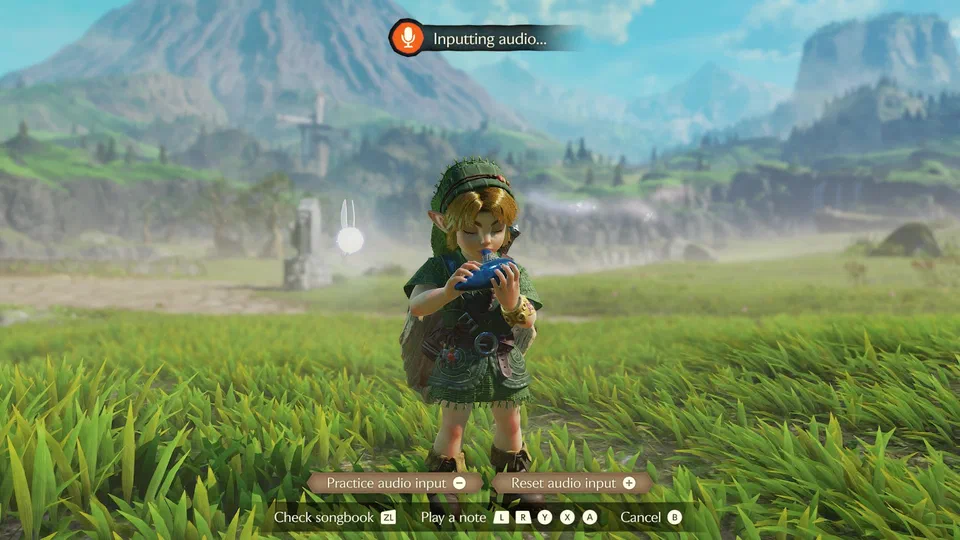 Link playing the Ocarina of Time in Hyrule Field with a microphone icon and Inputting audio... at the top of the screen; the bottom bar reads Practice audio input, Reset audio input, Check songbook ZL, Play a note L R Y X A, Cancel B